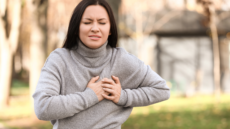 woman having chest pain